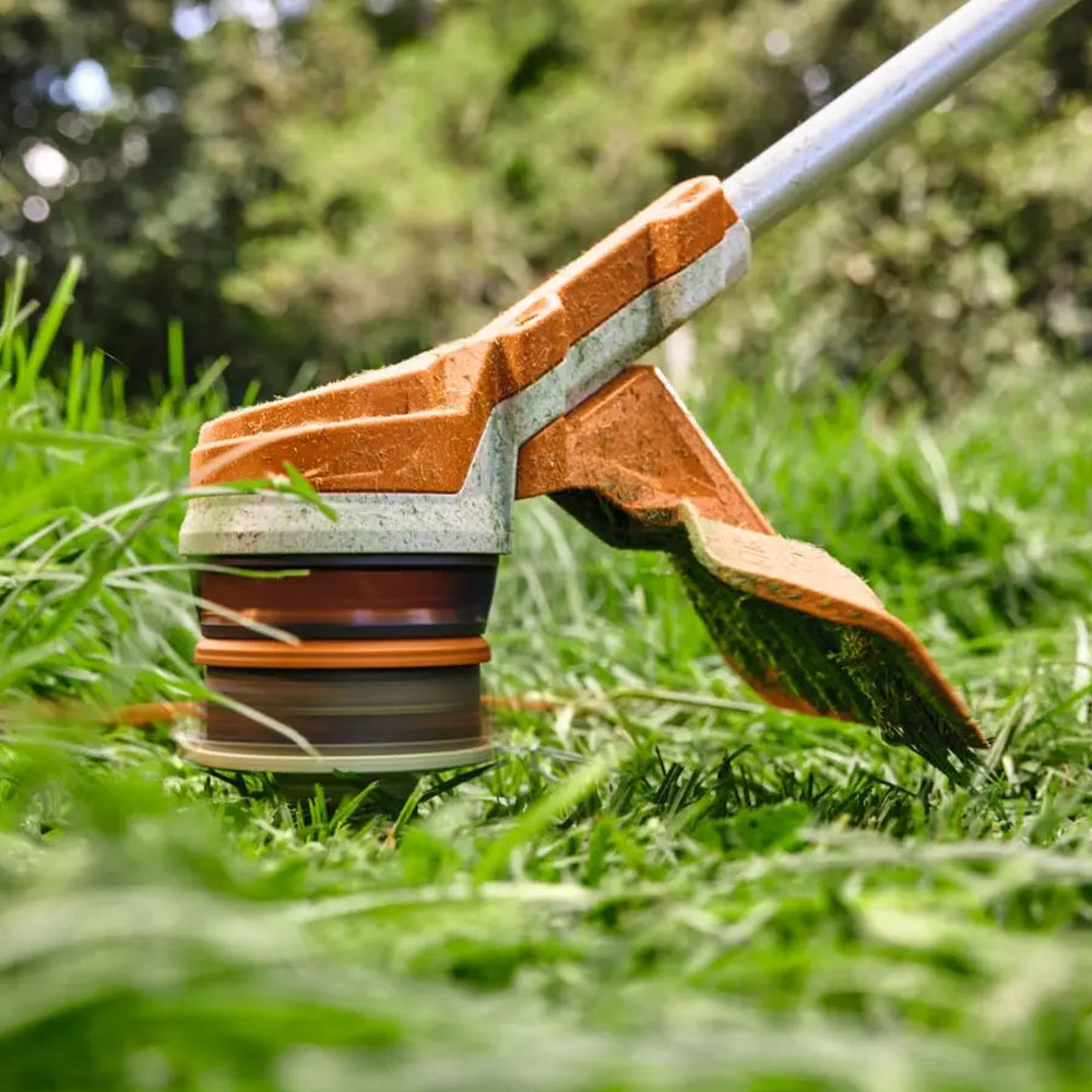 STIHL FSA 70 R Battery Grass Trimmer AK System Kit cutting grass - A versatile battery grass trimmer kit with battery and charger for trimming, mowing and clean-up work. available at Cannings Melbourne Victoria 